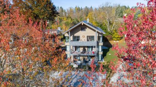 an aerial view of a house with trees at INVITA Natur-Chalets in Bad Dürrheim