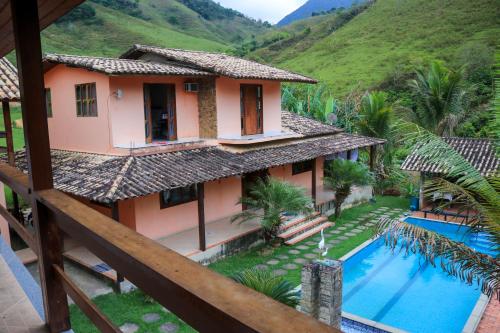 an aerial view of a house with a swimming pool at Pousada Vale do Luar in Sana