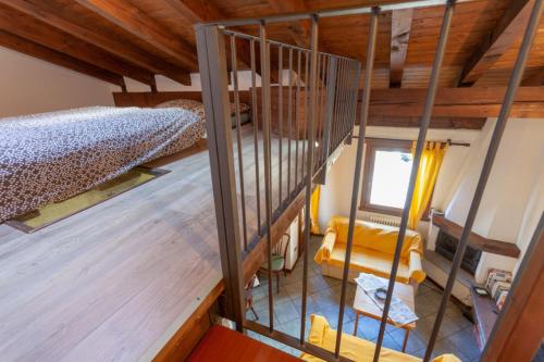 an overhead view of a room with a bed and a window at Chalet Mew in La Thuile