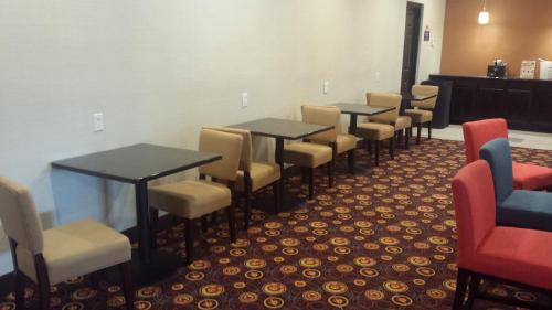 a row of tables and chairs in a waiting room at Days Inn by Wyndham Henryetta in Henryetta