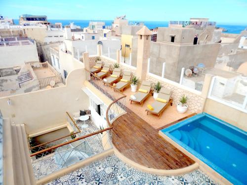 a view from the balcony of a villa with a swimming pool at Suite Azur Hotel in Essaouira