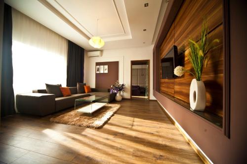 a living room with a couch and a table at Hotel Confort in Cluj-Napoca