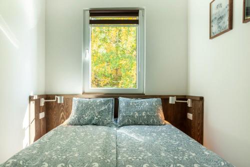 Een bed of bedden in een kamer bij Srebrna Petica