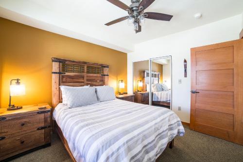 a bedroom with a large bed and a ceiling fan at White Mountain Lodge #2329 in Mammoth Lakes