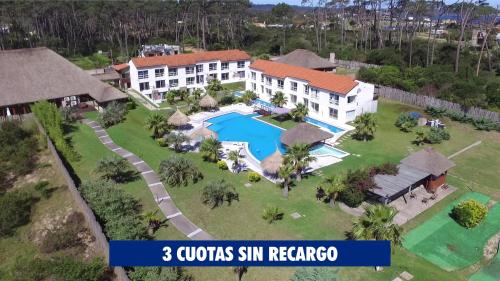 an aerial view of a villa with a swimming pool at Punta del Este Arenas Hotel in Punta del Este
