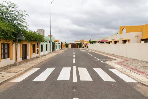 an empty street with a crosswalk in a town at VILLA PHOEBE Cité BOAD Lomé Baguida in Lomé