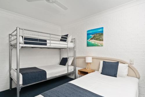 Postel nebo postele na pokoji v ubytování Wollongbar Motel