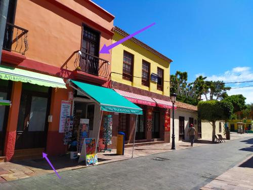 a street in a town with shops and buildings at Apartamento La Peatonal in San Sebastián de la Gomera