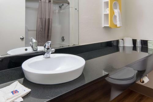 a bathroom with a sink and a toilet at Motel 6-Duncanville, TX - Dallas in Duncanville