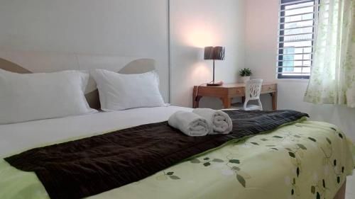 Säng eller sängar i ett rum på Tropicana Home Concept@Saujana KLIA, Sepang