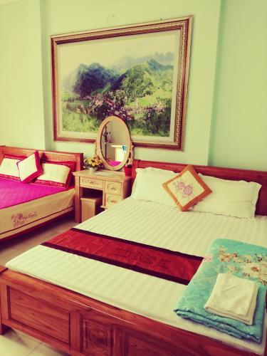 Ένα ή περισσότερα κρεβάτια σε δωμάτιο στο Thien An Guest House