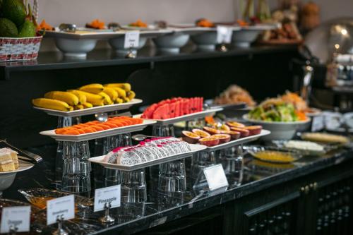a buffet with several plates of food on display at Imperial Hotel & Spa in Hanoi