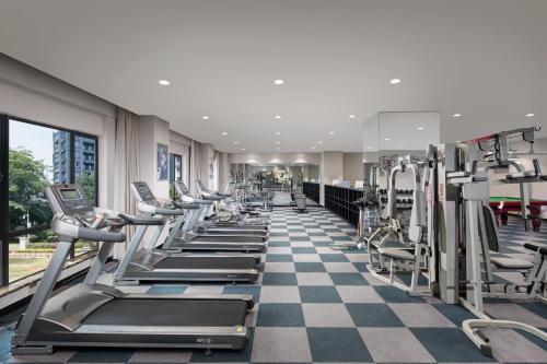 a gym with rows of treadmills and machines at Wyndham Garden Wenchang Nanguo in Wenchang