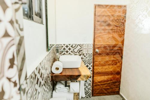a bathroom with a toilet and a sink at SIX TWO FOUR Urban Beach Hotel in San José del Cabo