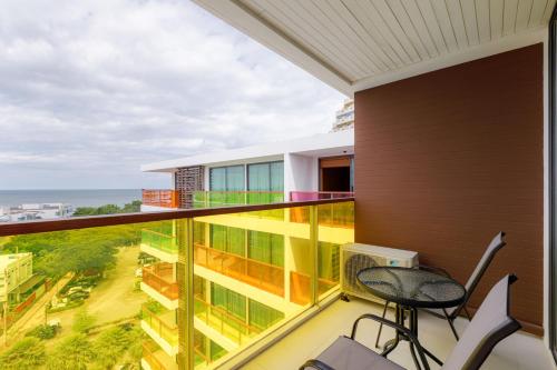 a balcony with a view of the ocean at Rocco Hua Hin Beach Seaview in Hua Hin