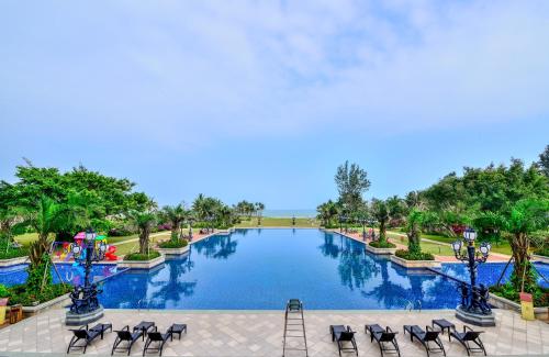 a view of a pool at a resort at Wyndham Garden Wenchang Nanguo in Wenchang