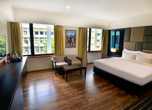 Postel nebo postele na pokoji v ubytování Hotel Ranjith