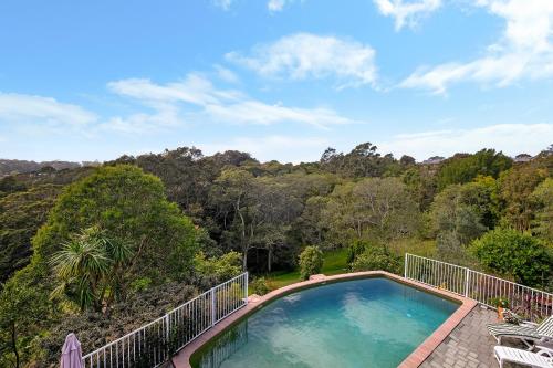 a swimming pool on the balcony of a house at Valley View Bed and Breakfast in Newcastle
