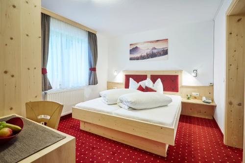 מיטה או מיטות בחדר ב-Gasthof Walderhof