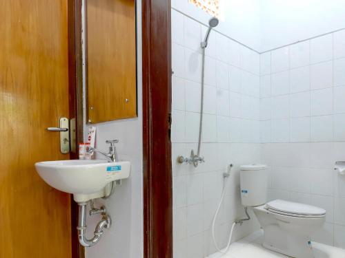 a bathroom with a sink and a toilet at Sekar Arum Riverside Resort in Canggu in Tanah Lot