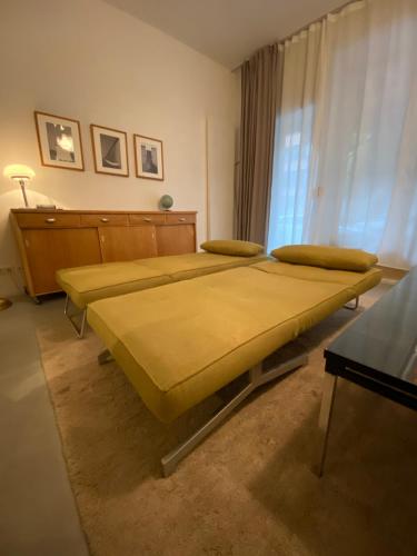 a bedroom with a large bed in a room at Ladenwohnung in Kreuzberg mit Parkplatz in einer Tiefgarage in Berlin