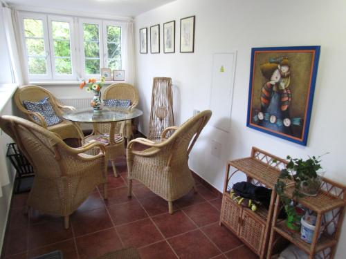 a dining room with a table and chairs at Chalupa Pomněnka in Jáchymov