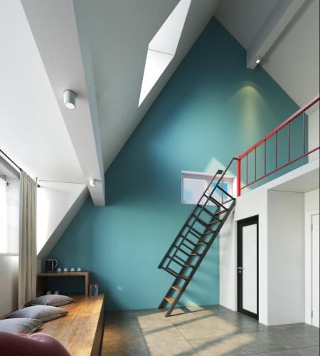 a room with a blue wall with a spiral staircase at Le vent Tam Đảo homestay in Tam Ðảo