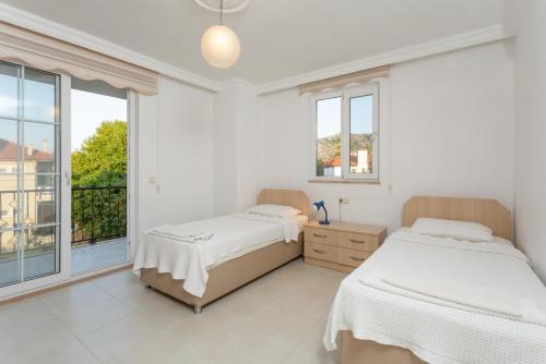 Un pat sau paturi într-o cameră la Villa Kubra