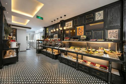 a kitchen filled with lots of different types of food at Shining Central Hotel & Spa in Hanoi