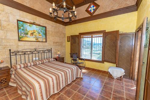 Postel nebo postele na pokoji v ubytování Cubo's Villa Ana Valtocado