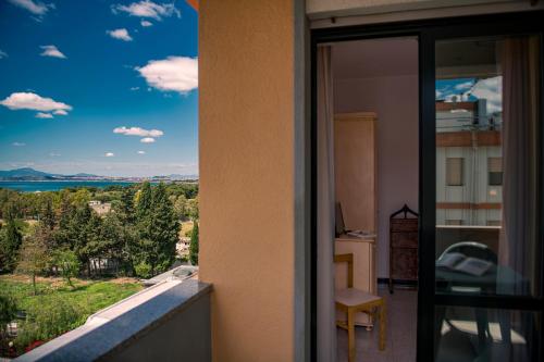 a view out a window of a house at Hotel Califfo in Quartu SantʼElena