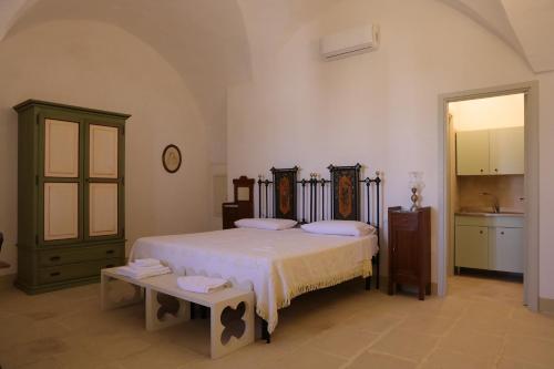 Postel nebo postele na pokoji v ubytování masseria Carlini