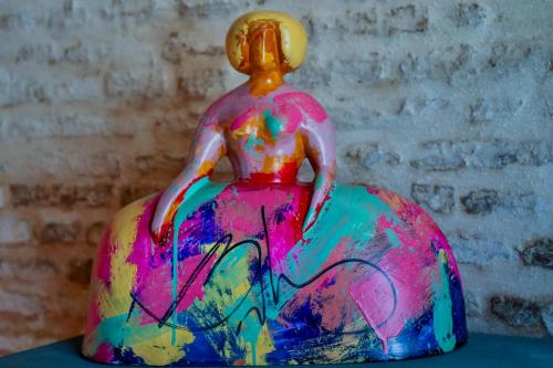 a colorful figurine of a person riding an elephant at Hotel Lobby in Seville