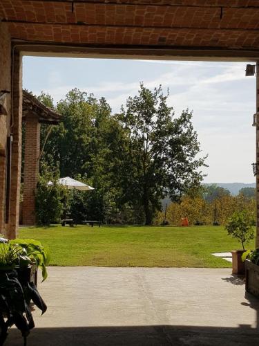 a view of a park from a patio at THE BERGHOUSE - LA CASA SUL CLIVO with JACUZZI in Bergamasco