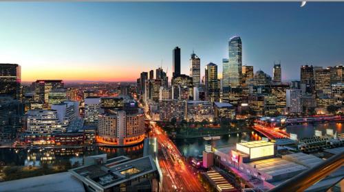 a view of a city skyline at night at Jade Resorts Melbourne in Melbourne