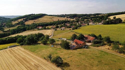an aerial view of a farm with a field at Au dessus de Parady in Gillonnay