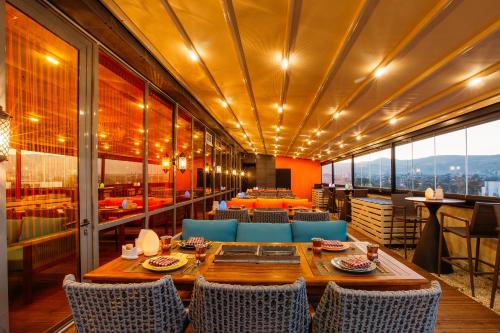a dining room with a table and chairs at Golden Palace Hotel in Tbilisi City