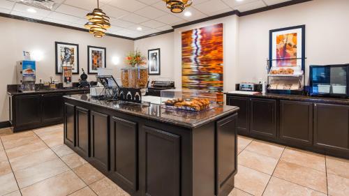 a lobby with a counter with food on it at Best Western Executive Hotel New Haven-West Haven in West Haven