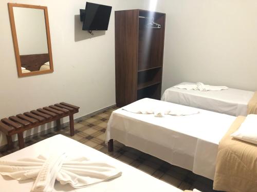 Katil atau katil-katil dalam bilik di Thanharu Praia Hotel
