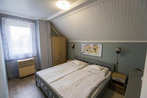 Postel nebo postele na pokoji v ubytování Joli Guesthouse