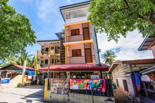 a building with a store in front of it at Casa Bonita Inn Oslob in Oslob