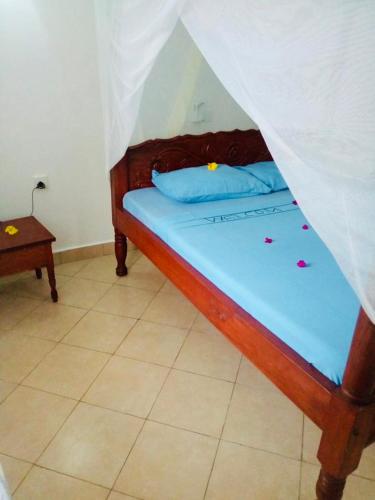 Postel nebo postele na pokoji v ubytování Casa da Luna Watamu Kenya