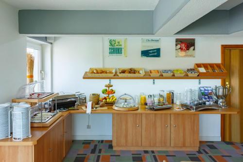 Η κουζίνα ή μικρή κουζίνα στο City-Pension Dessau-Roßlau