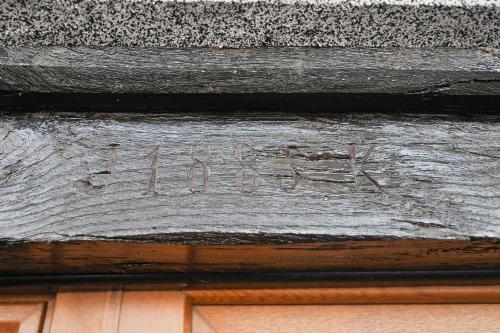 a sign on the side of a building with writing on it at Apartments Jernej with Onsite Wellness in Brežice