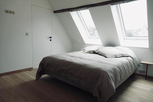 En eller flere senge i et værelse på Le Grenier - Résidence Le Cercle