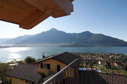 a view of the lake and mountains from a house at Residence La Collina in Vercana