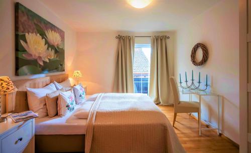 a bedroom with a bed and a desk in it at Chalet Schott in Kirchberg in Tirol