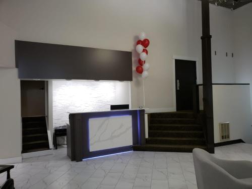 a room with a large screen in the middle of a building at Wells Gray Inn in Clearwater