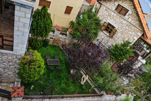 an overhead view of a garden in front of a building at Abelos Villas in Áyios Ioánnis