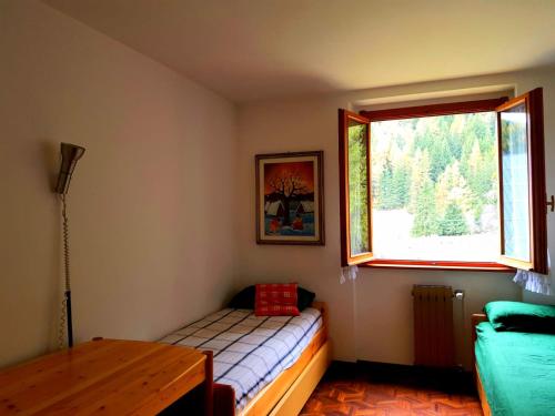 Ένα ή περισσότερα κρεβάτια σε δωμάτιο στο Monterosa Apartment - Champoluc #Bluchalet